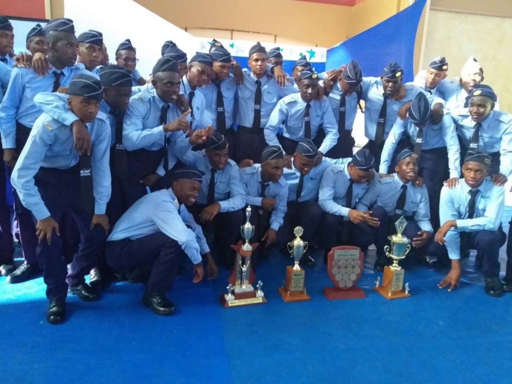 Newly capped cadets of the Charlie cohort pose with their special awards which includes Best Drilling Cohort and Best Cohort at the capping ceremony.  PHOTO BY TYRELL GITTENS