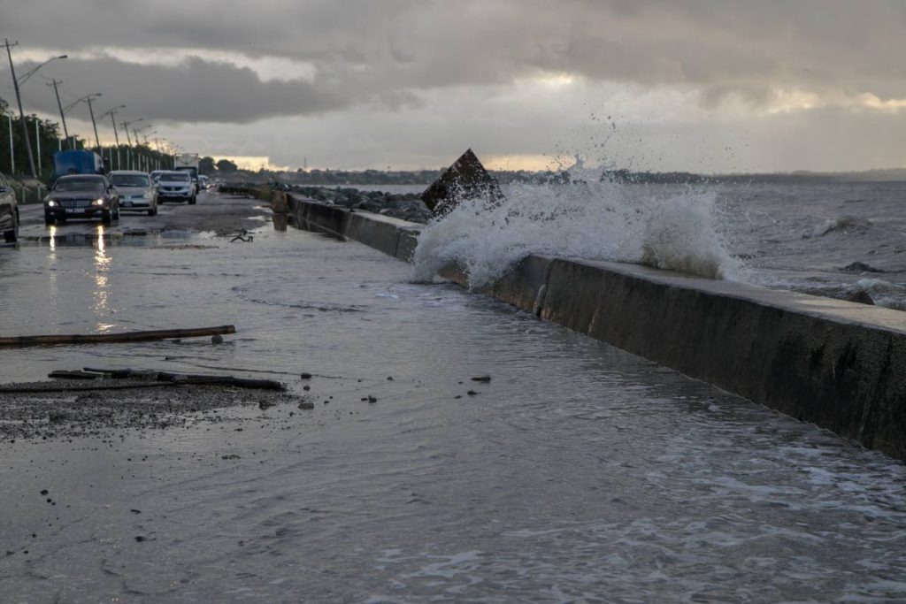 In this file photo waves crash over the sea wall along Mosquito Creek. Photo by Jeff K Mayers