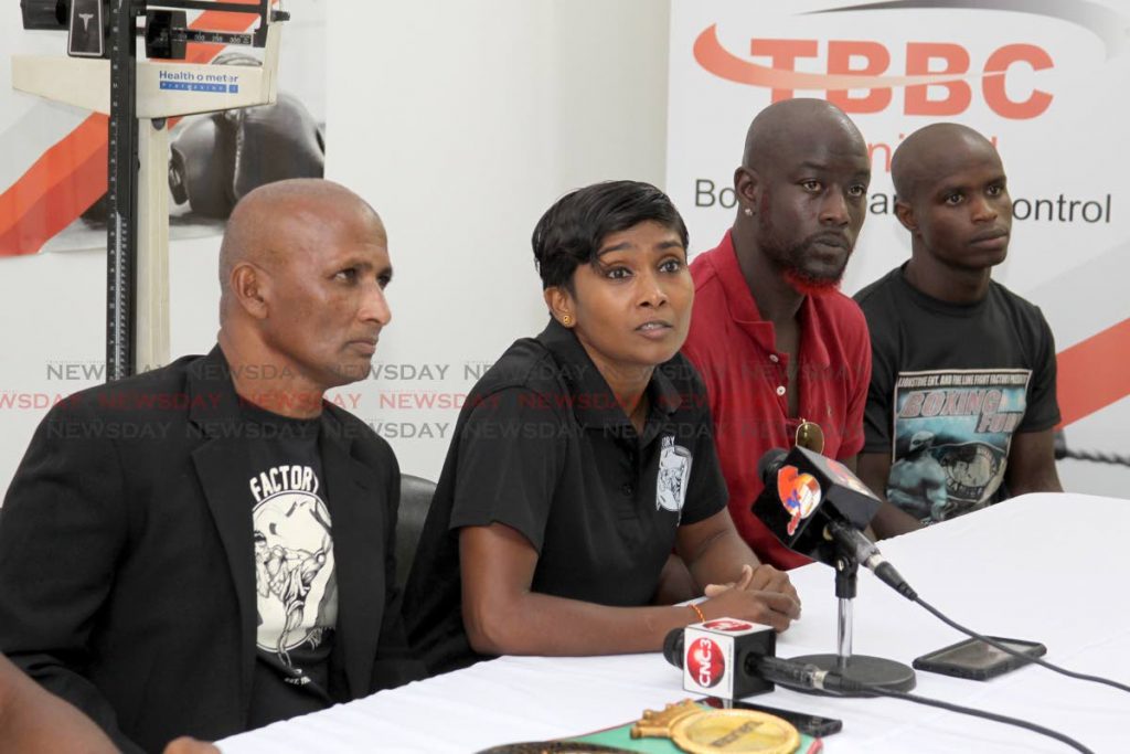  Ria Ramnarine, Public Relations Officer FineLine Promotions,
alongside Bharath Ramoutar of FineLine Fight Promotions, Terry Bush, Fight Supervisor and representing Lionstone Entertainment, and boxer Prince-Lee Isidore,  The media conference called to weighing boxers for the Lionstone Entertainment and Fine Line Fight Factory entitle Boxing Fury, to be held at Chaguanas Indoor Sporting Complex on Saturday, was cancelled due to a lack of funding,
The offices of the Trinidad Boxing Board of Control, 
Hasley Crawford Stadium, Port of Spain.
Friday, September 27, 2019. PHOTO BY ROGER JACOB.