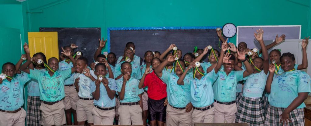 EXCITED TO LEARN: Students of the Buccoo Government Primary School are happy to be in school.