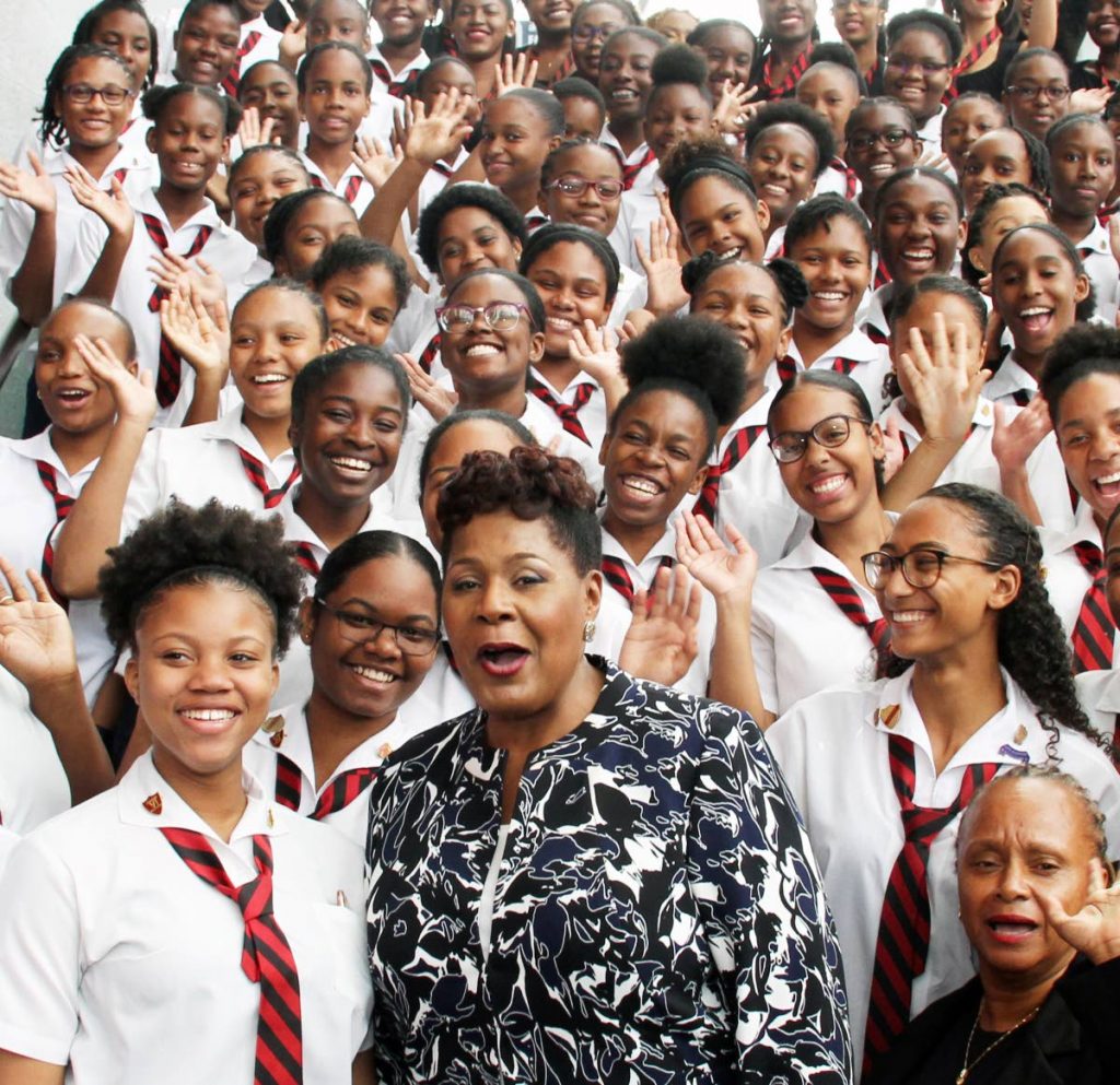 In this March 19, 2018 file photo President Paula-Mae Weekes with students of her alma mater Bishop Anstey High School during an inauguration reception at NAPA, Port of Spain. 