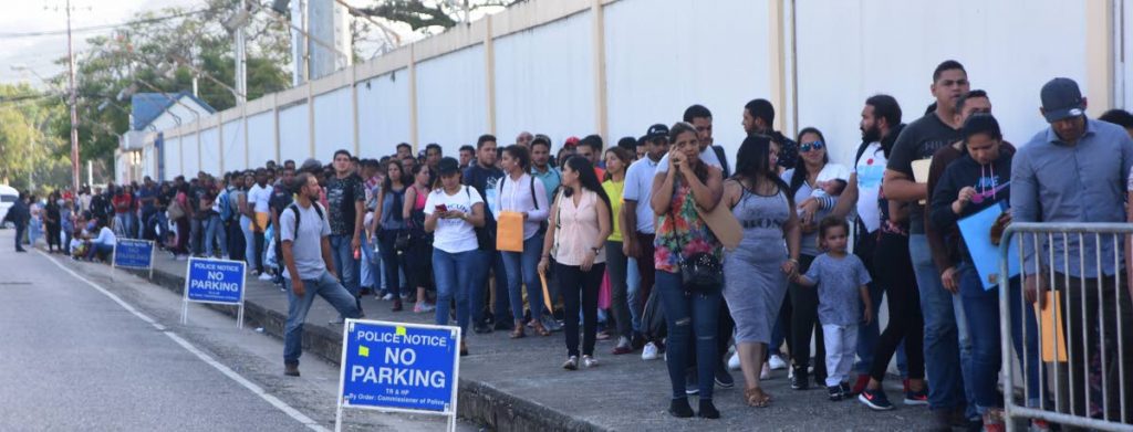 In this June 3, 2019 file photo, Venezuelans line up to register to work in TT for a year at Queen's Park Oval, Port of Spain.