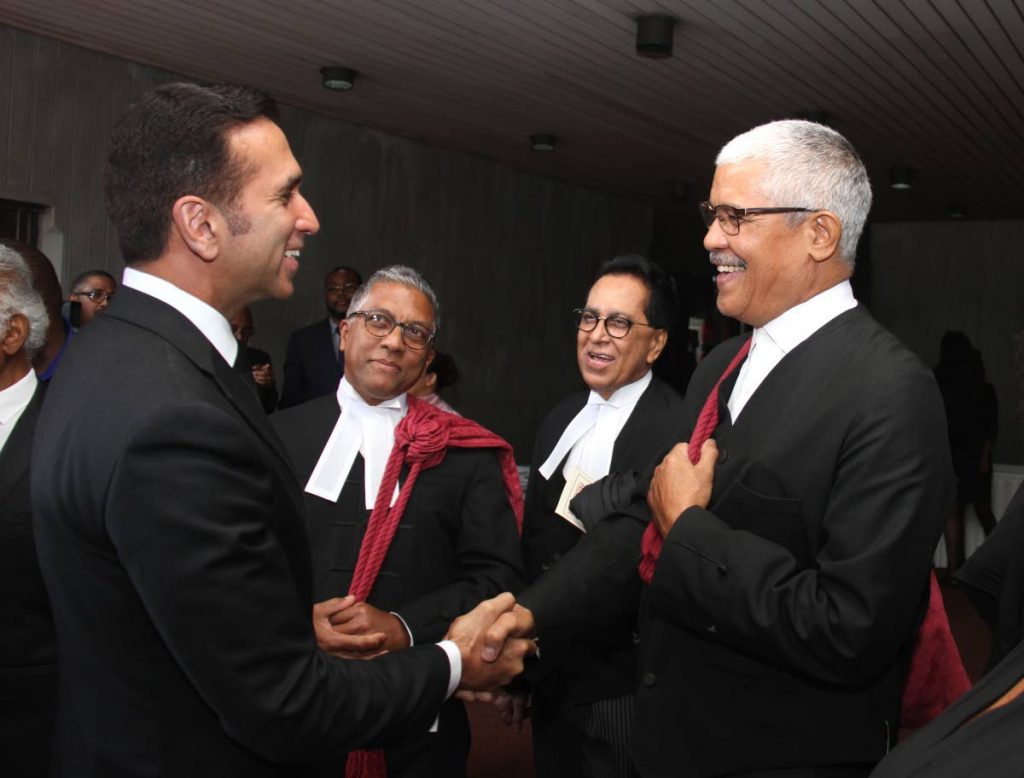 Senior counsel Reginald Armour (second from left) looks on as Attorney General Faris al-Rawi chats with Law Association president Douglas Mendes at the opening of the 2019/2020 law term. Armour also heads Dialogue Solutions Ltd which is recommending alternative dispute resolution as an ideal approach for reducing time and the cost of litigation in TT. FILE PHOTO