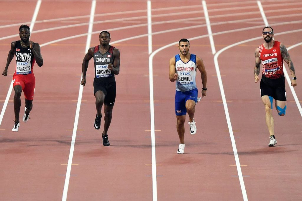 Jereem Richards, of Trinidad And Tobago, Aaron Brown, of Canada, Adam Gemili, of Great Britain, and Ramil Guliyev, of Turkey, from left to right, compete in the men's 200 meter semifinals during the World Athletics Championships in Doha, Qatar, Monday, Sept. 30, 2019. (AP Photo/Martin Meissner)