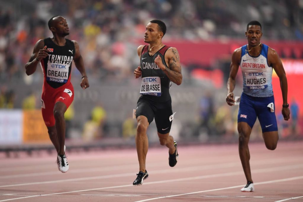 Canada’s Andre De Grasse (C) leads Trinidad and Tobago’s Kyle Greaux (R) and Britain’s Zharnel Hughes in the Men’s 200m semi-final at the 2019 IAAF Athletics World Championships at the Khalifa International Stadium in Doha, yesterday.