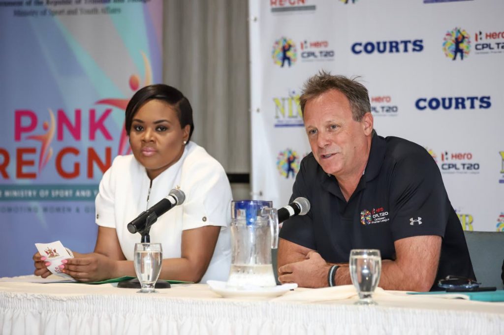 Hero CPL COO Pete Russell addresses a Hero Caribbean Premier League press conference yeasterday, at the Hilton Trinidad. At left, Minister of Sport and Youth Affairs Shamfa Cudjoe looks on.