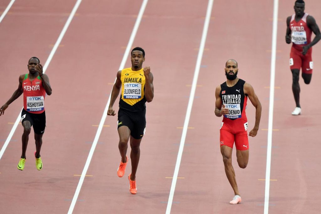 Machel Cedenio, of Trinidad And Tobago, second right, and Akeem Bloomfield, of Jamaica, second left, compete in the men's 400 meter heats at the World Athletics Championships in Doha, Qatar, Tuesday, Oct. 1, 2019. Left is Alphas Leken Kishoyian, of Kenya, right is Abdalelah Haroun, of Qatar. (AP Photo/Martin Meissner)