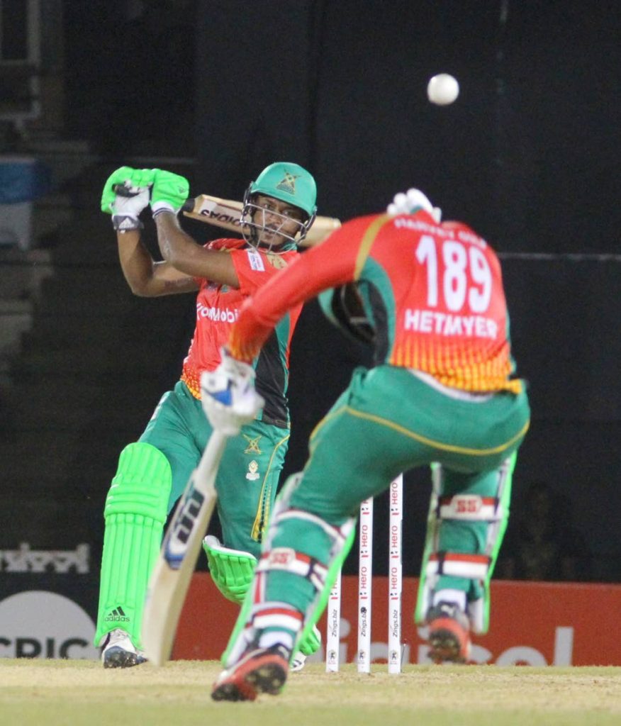 Guyana Amazon Warriors’ Chanderpaul Hemraj plays a shot that barely misses Shimron Hetmyer, during the hero Caribbean Premier League match against the Trinbago Knight Riders, on Monday night, at the Queen’s Park Oval.