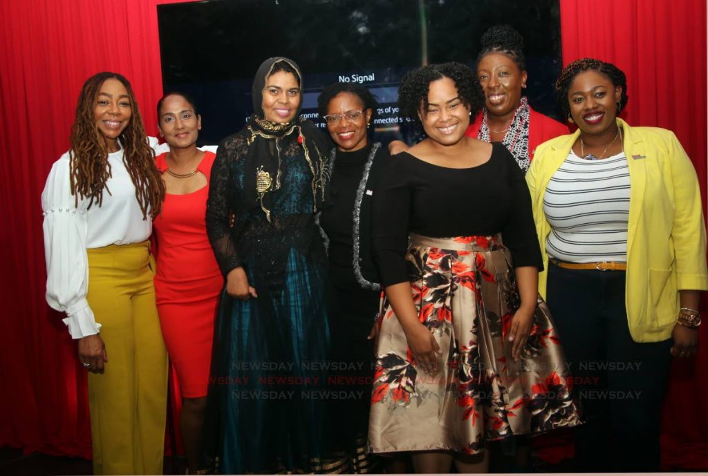 Digicel Foundation CEO Penny Gomez (left) with members of the team during its AGM at the Digicel suite, Queen's Park Oval on Thursday.  PHOTO BY SUREASH CHOLAI
