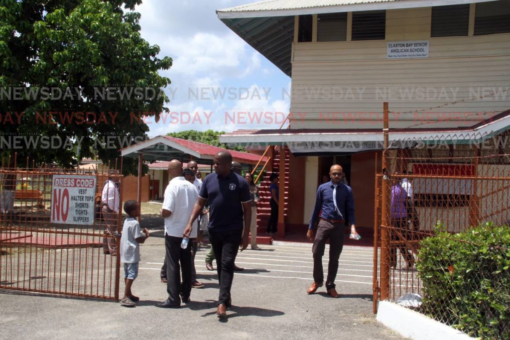 Minister in the MInistry of Education Lovell Francis ,  together with representatives of the ministry and  NPTA  leave  the Claxton Bay Senior Anglician School this morning. Photo by Vashti Singh