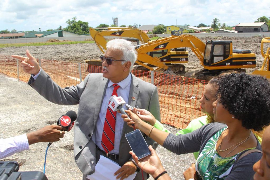 GO THIS WAY: Health Minister Terrence Deyalsingh speaks with reporters about the new Sangre Grande 
hospital during the sod-turning ceremony yesterday.  Prime Minister Dr Keith Rowley was also present 
and called on citizens to be grateful for what TT has.   PHOTO BY ROGER JACOB