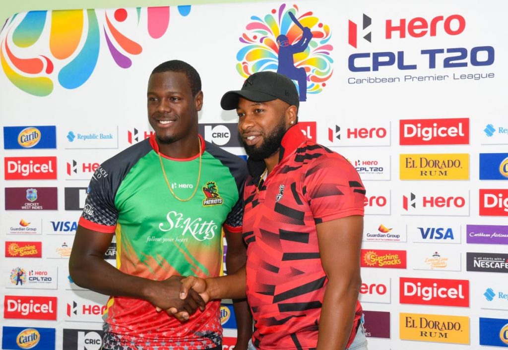 St Kitts and Nevis Patriots captain Carlos Brathwaite, left, greets Trinbago Knight Riders captain Kieron Pollard, at a pre-match press conference, held at the Guyana National Stadium, Providence, Guyana, on Saturday. Photo courtesy CPLT20