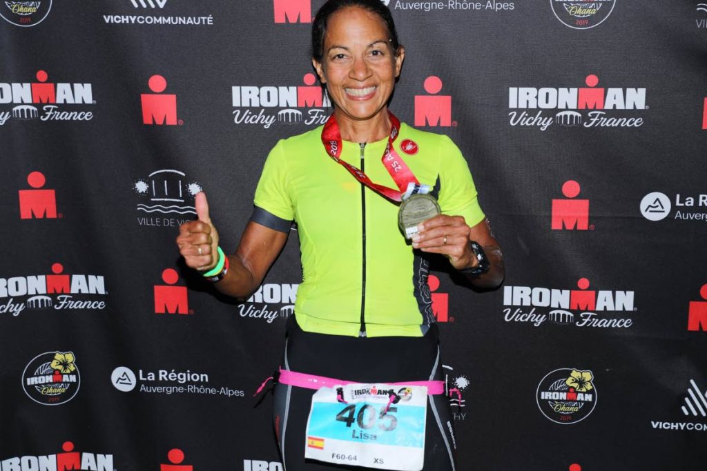 TT's Lisa Cockburn shows off her silver medal at the IronMan Vichy (triathlon) in France recently.