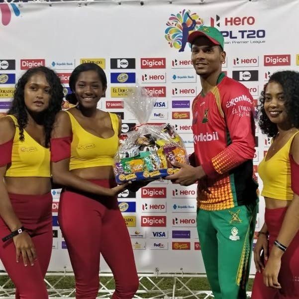 Brandon King (second from right) collects his Man of the Match hamper after yesterday's match. PHOTO COURTESY CPL T20.