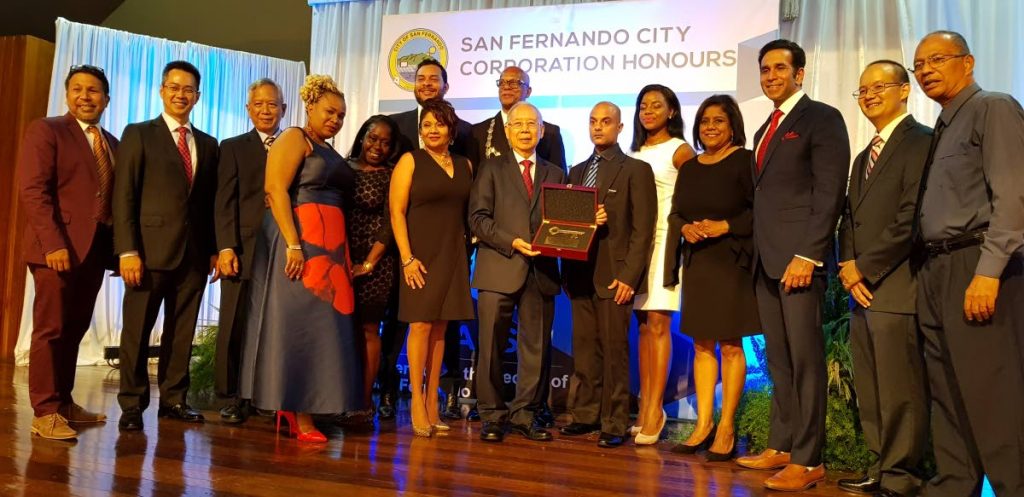 CITY KEYS: Carl Mack, chairman of the JT Allum Group of Companies receives the keys to the city during a gala ceremony last Friday at City Hall, San Fernando. 
PHOTO BY YVONNE WEBB 