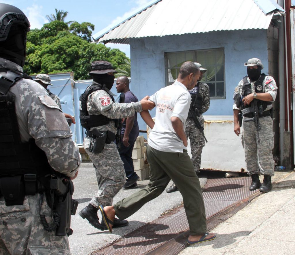 Police remove a man from the rehab centre. 