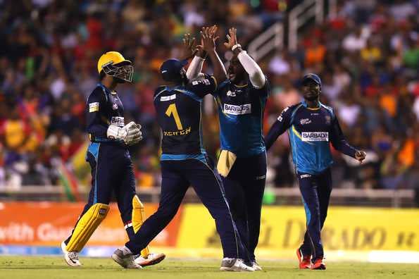 Members of the Barbados Tridents team celebrate a wicket in yesterday's Hero CPL final against Guyana Amazon Warriors. PHOTO COURTESY HERO CPL T20.