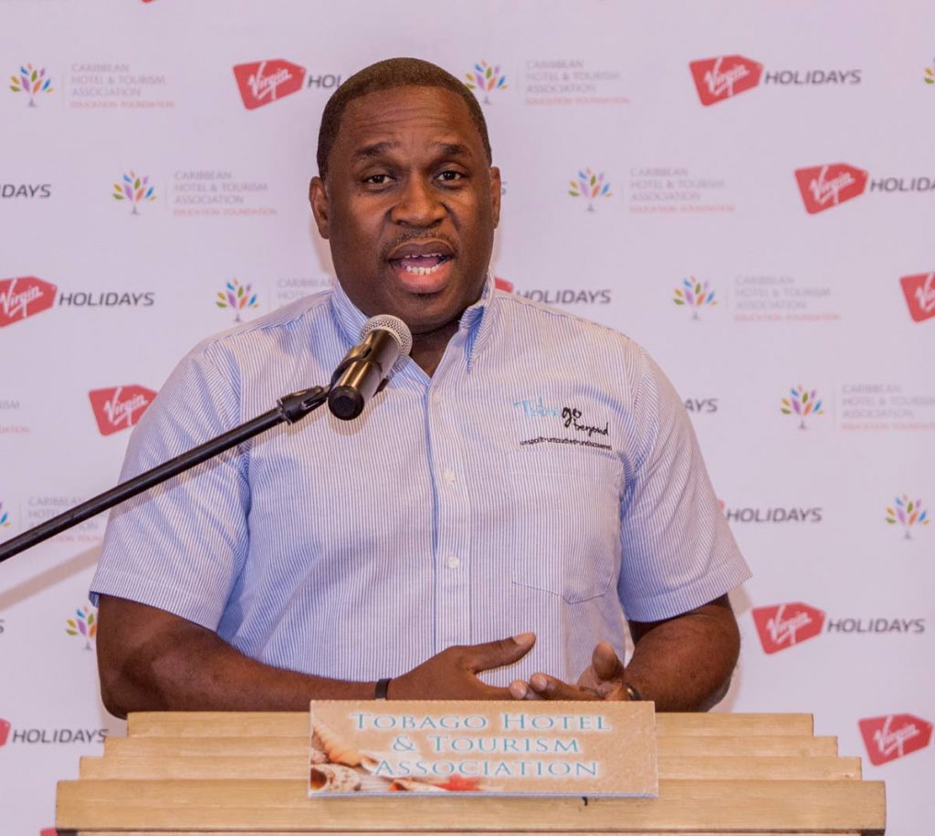 Tobago Tourism Agency Ltd CEO Louis Lewis addresses participants at Friday's tourism hospitality initiative at Coco Reef Hotel in Crown Point. PHOTO BY DAVID REID  - DAVID REID 