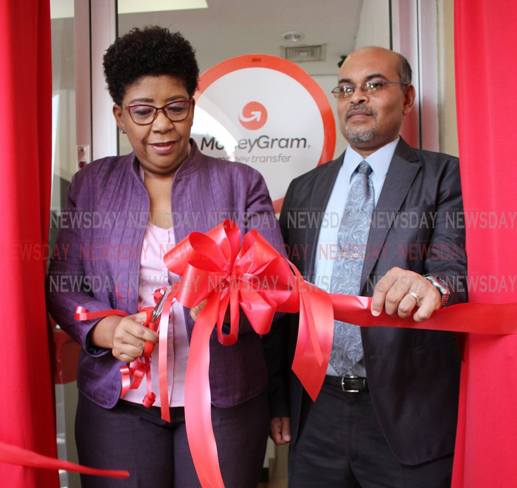 TTPost Managing Director George Alexis, right and Chairman of the Board of Directors, Eula Rogers cut thr ribbon to officially open the new TTPost branch at Grand Bazaar Mall on Tuesday.

PHOTO:ANGELO M. MARCELLE
22-10-2019