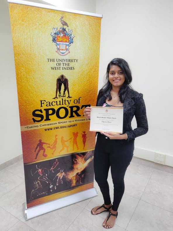 TT international archer Priyanka Dhanie with the first ever Dean’s Student-Athlete Award issued by the University of the West Indies’s Faculty of Sport.  - 