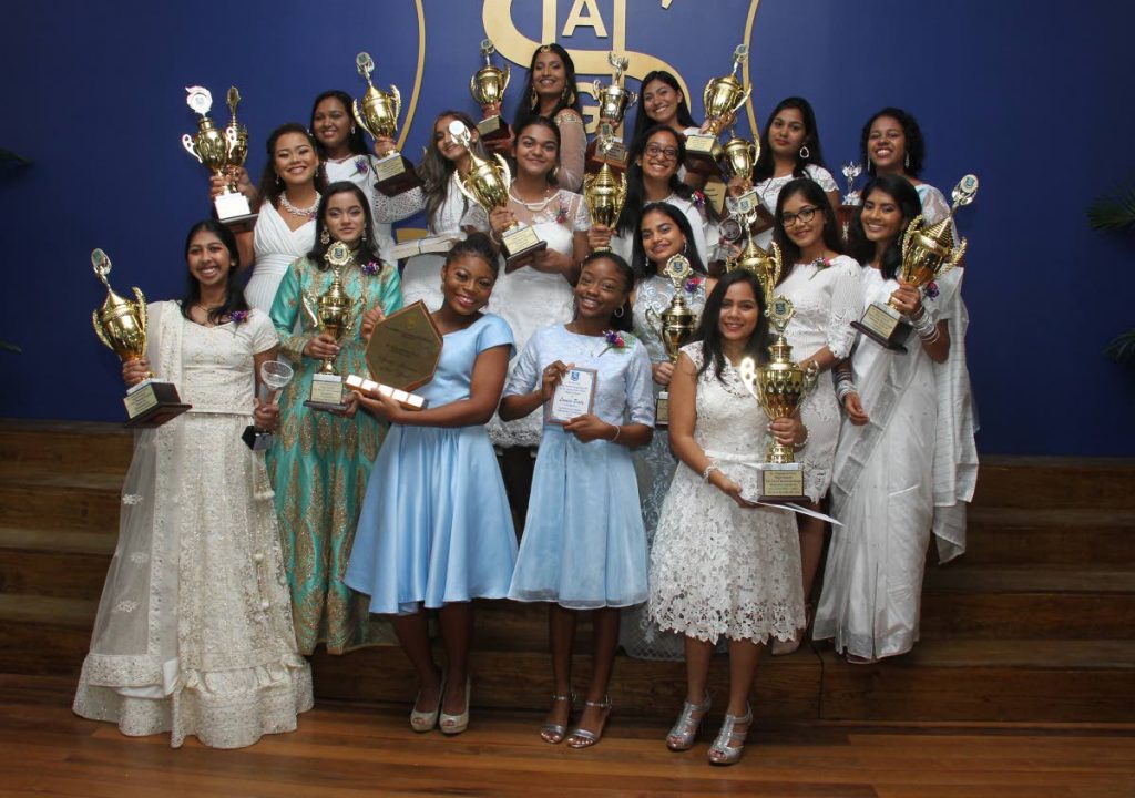 St Augustine Girls' High School graduates smile with their trophies and awards at their graduation ceremony at the Anna Mahase Auditorium, Evans Street, Curepe on Thursday. PHOTO BY AYANNA KINSALE  - 