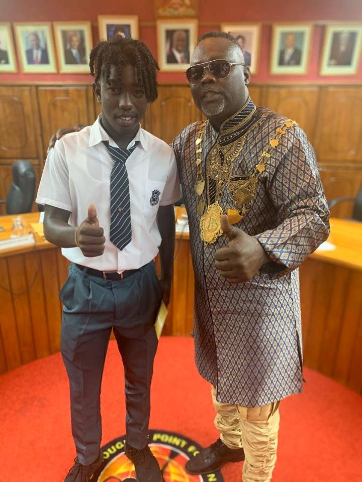 National U-15 and Naparima College standout, Isaiah 'Messi' Thompson, left, with Point Fortin mayor, Abdon Mason, at a small recognition ceremony highlighting Thompson's selection to play in Europe. - 