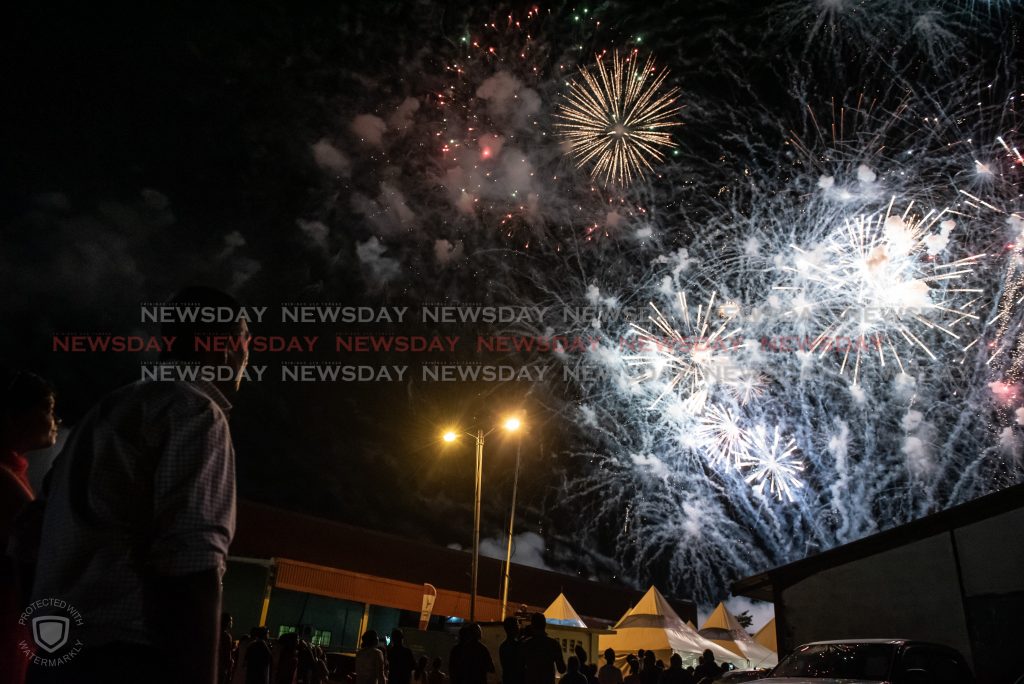 Spectators look on at the fireworks on the final night of the Divali celebrations at the NCIC Nagar in Chaguanas on Saturday sings for the audience on the final night of the Divali celebrations at the NCIC Nagar in Chaguanas on Saturday.

Photo: Elliot Francois