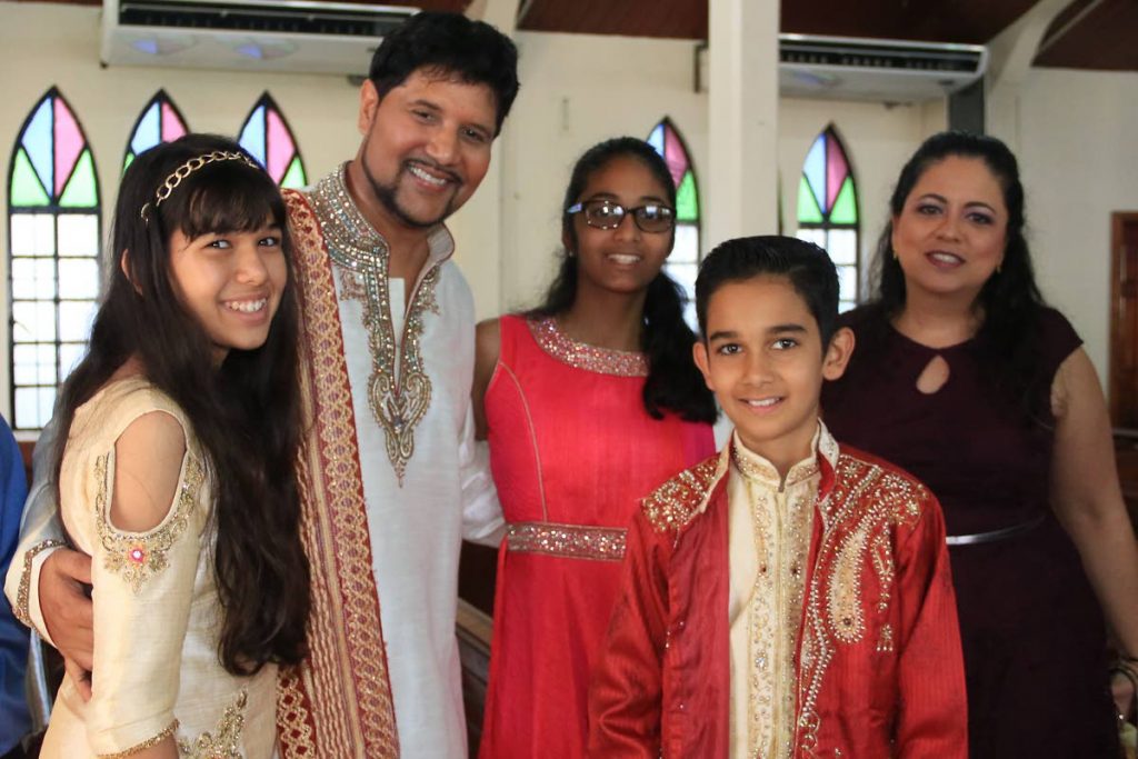 JUSTICE Frank Seepersad, second from left, with his family and members of the Marabella Presbyterian Church. Seepersad delivered the sermon at yesterday's service. - MARVIN HAMILTON