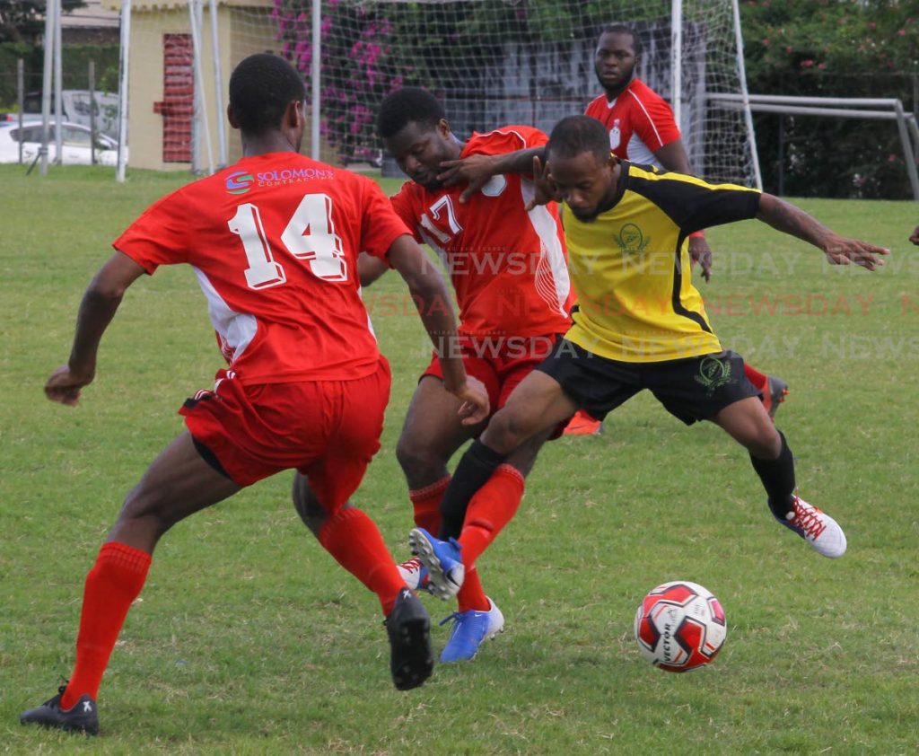 Osaze Springer (R), of RSSR FC, and Bethel United’s Ackel Carrington (17) vie for the ball during a Super League encounter, at the Hasely Crawford Stadium,on Sunday. - ROGER JACOB