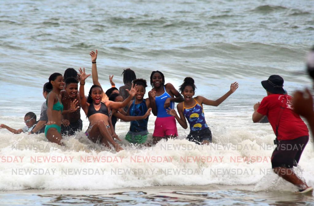 A group of teenagers have fun in the water together at Maracas Bay.

— SUREASH CHOLAI
