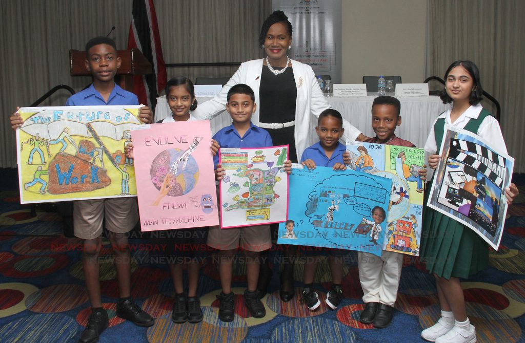Participants of the of the poster competition on The Future of Work in commemoration of the International Labour Organisation (ILO) smile for a picture with Minister of Labour and Small Enterprise Development Jennifer Baptiste-Primus during the prize giving ceremony at the La Boucan Room, Hilton Trinidad and Conference Centre on Tuesday. 

PHOTO BY AYANNA KINSALE