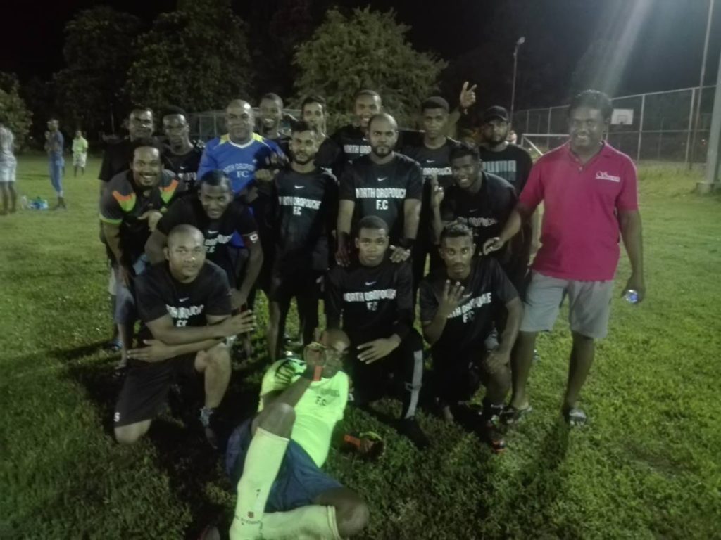 North Oropouche players and supporters after beating Manzanilla Challengers in the Fishing Pond Football league Big 8 on Monday.  - 