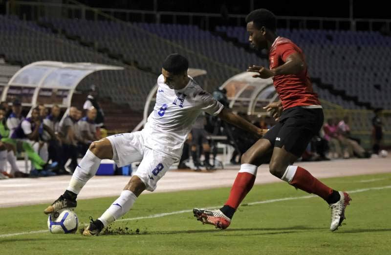 Honduras midfielder Carlos Pineda controls the ball ahead of TT's Levi Garcia during the teams' Concacaf Nations League match at the Hasely Crawford Stadium, Mucurapo on October 10. Honduras won the game 2-0. PHOTO COURTESY CONCACAF. - 