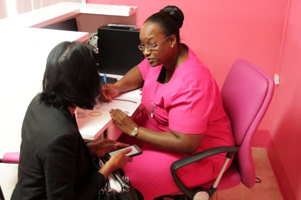 A nurse chats with a woman at the Pink Room in Delaford.  - THA