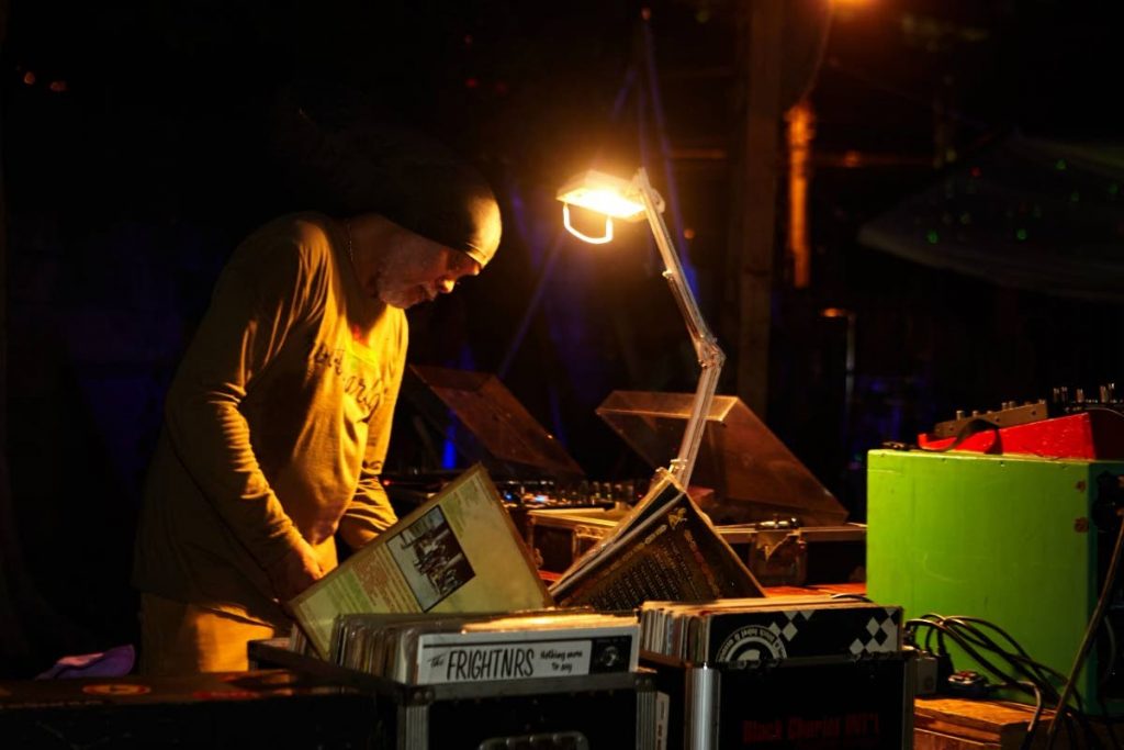 Rootsyardd resident selector Gauge of Black Chariot searches his vinyl record collection. - 