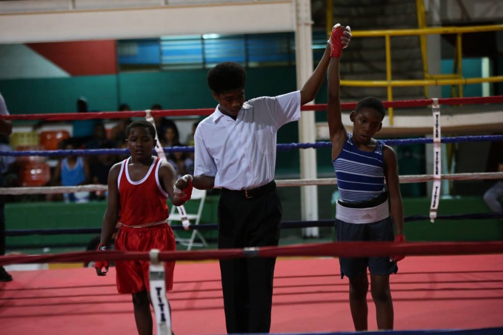 Amari Rodney (right) is adjudged the winner of his bout against Sharnick Phillip (left) at the National Boxing Championships. PHOTO BY JEFF MAYERS. - Jeff K Mayers