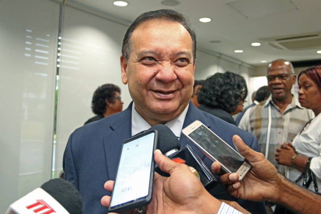 ENERGETIC TALK: Energy Minister Franklin Khan speaks with reporters yesterday at Heritage Petroleum Company’s administrative building in Santa Flora.  - MARVIN HAMILTON