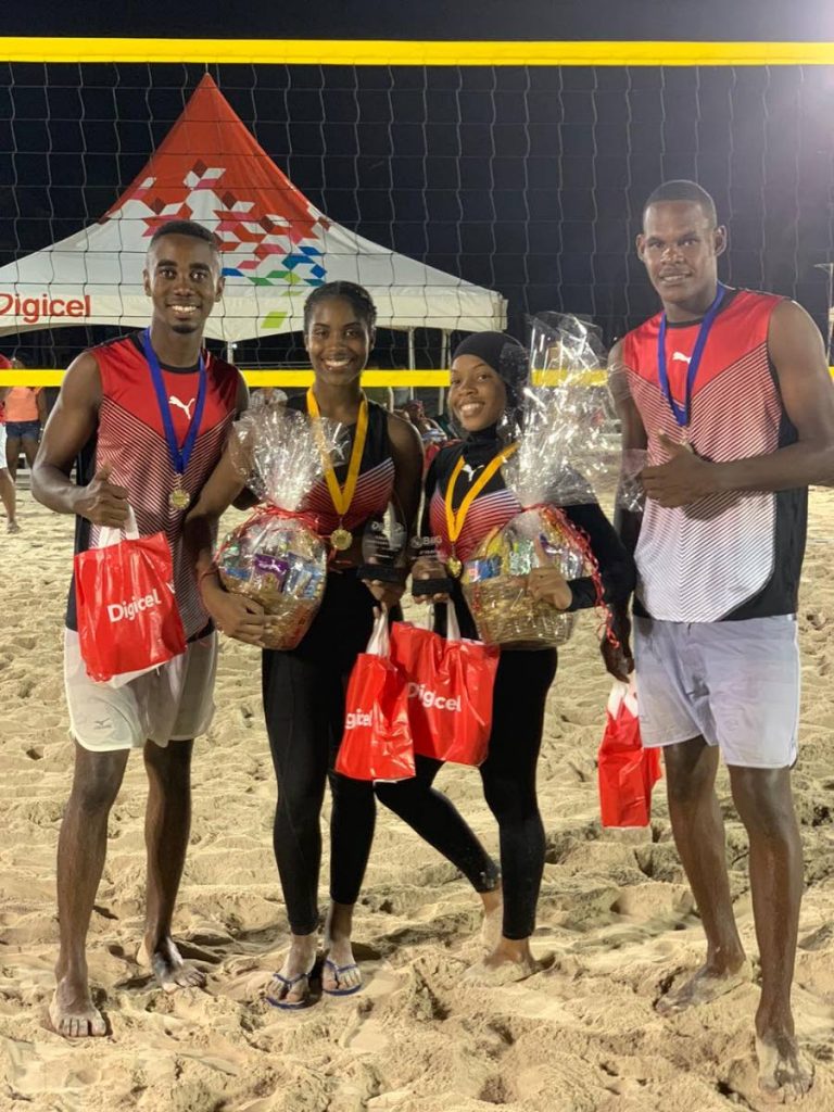 TT beach volleyballers,from left to right, Stephen Enile,Tsyan Selvon, Asma Charles and Joel Theodore display their prizes after competing, over the weekend, at the Barbados Olympic Association Independence Invitational Games (BIIG) at Pirate’s Cove, Bridgetown, Barbados. - 