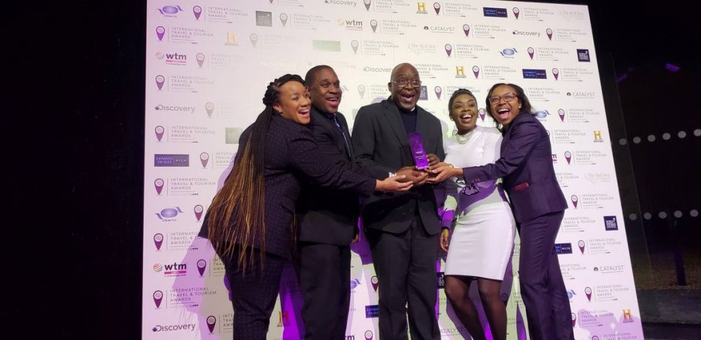 Chief Secretary Kelvin Charles, centre, with the silver award for Best National Tourism Board Campaign at the World Travel Market awards on Tuesday in London, England. Basking in the moment are Tobago Tourism Agency Ltd CEO Louis Lewis, second from left, Tourism Secretary Nadine Stewart-Phillips, second from right, and other members of the Tobago contingent.  - TTAL