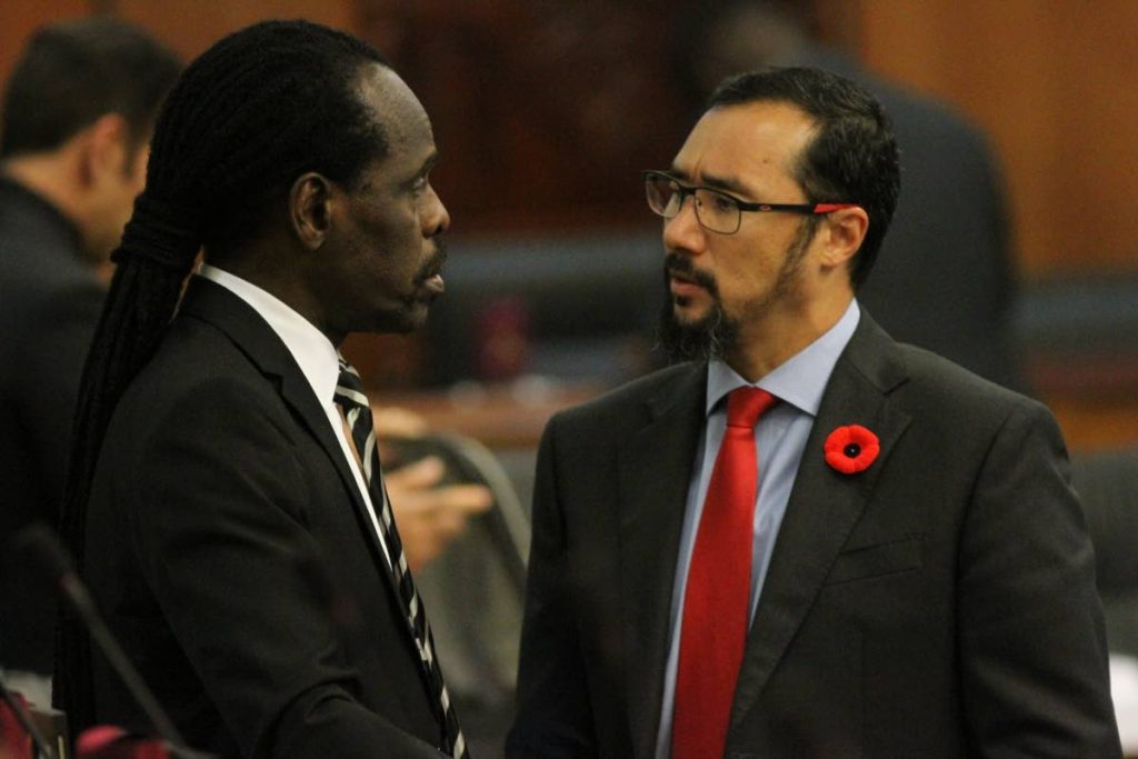 Minister of National Security Stuart Young, right, and Minister in the Ministry of the Attorney General Fitzgerald Hinds deep in conversation before the start of parliament yesterday.  - Angelo Marcelle