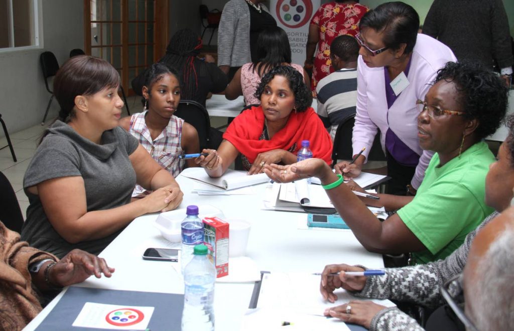 Parents take part in an activity during the Consortium of Disabilities Organisation training programme at Mt Hope/Mt Lambert Community Centre. PHOTO BY AYANNA KINSALE - Ayanna Kinsale