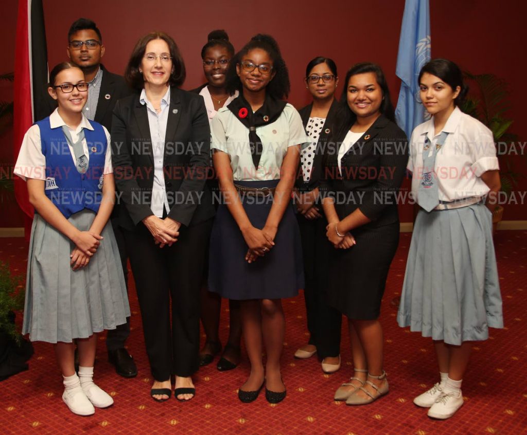 UN resident coordinator in TT, Marina Walter (3rd from left) with UN youth ambassadors Mariska van de Werken, Kelvin Naipal, Zakiya Calder, Tyisha Lovell, Tracy Jagerssar, Karishma Manwah and Katelyn Hutchison at the UN  Sustainamble Development Goals pinning ceremony. PHOTO BY ANGELO M MARCELLE - Angelo Marcelle