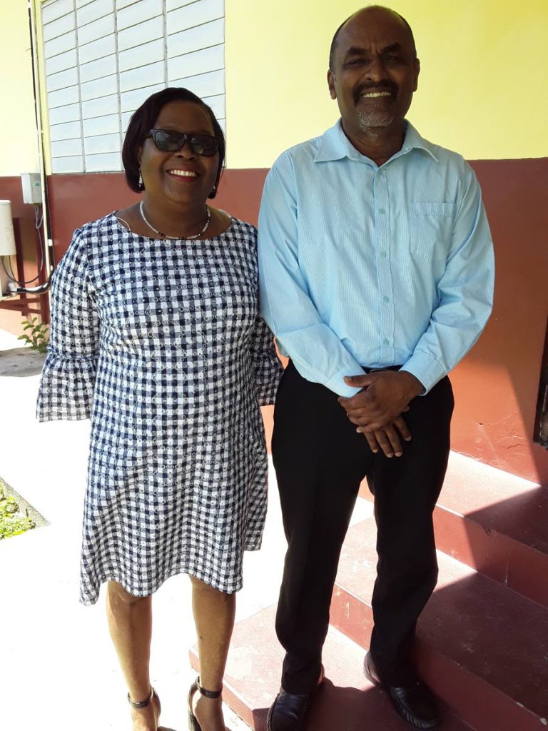 GOOD JOB: Retired principals Marjorie Brumant and Stanley Mahase are all smiles after being honoured by the PoS Primary School Principals' Association at the St Crispin's Anglican Primary School on Thursday.  PHOTO BY ELIZABETH GONZALES - Elizabeth Gonzales