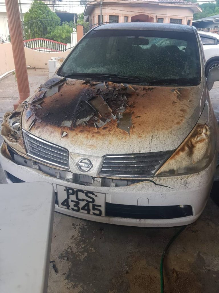 The family's car which was destroyed when the house was burnt. - 