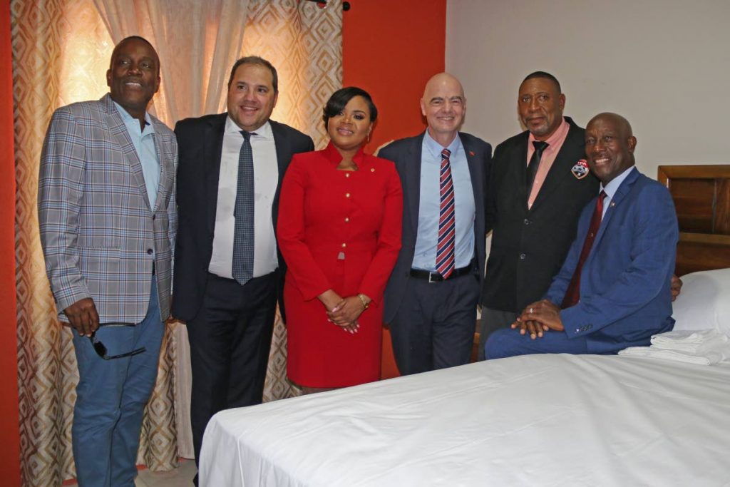From Left: Deputy Speaker Esmond Forde, Concacaf president Victor Montagliani, Minister of Sport and Youth Affairs Honourable Shamfa Cudjoe, FIFA president Gianni Infantino, TTFA President David John-Williams and Prime Minister Dr Keith Rowley during a tour of the hotel at The Home of Football complex, in Couva,yesterday - Marvin Hamilton