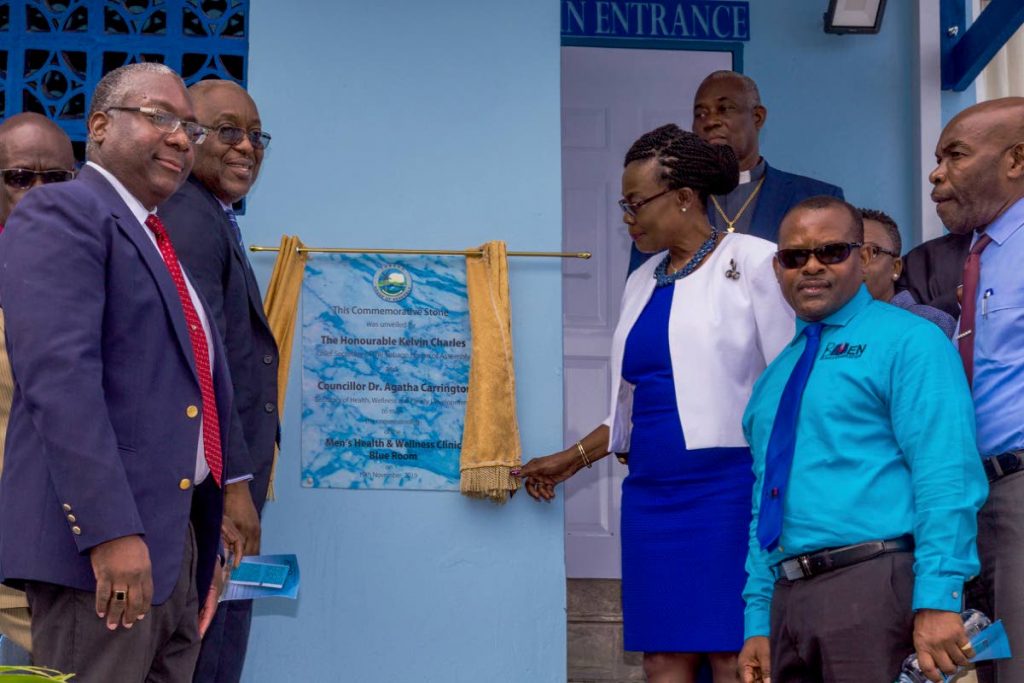 PROUD MOMENT: Unveiling the commemorative stone at the commissioning of the Blue Room on Tuesday are (from left) TRHA CEO Sheldon Cyrus, Chief Secretary Kelvin Charles, Health and Wellness Secretary Dr Agatha Carrington and founder of BMEN Organisation Michael Stewart on Tuesday in Scarborough.  - DAVID REID 