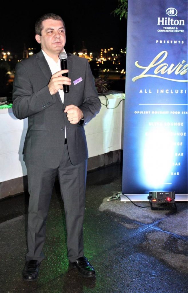 Hilton general manager Olivier Maumaire addresses guests at last Friday's launch of the hotel's all-inclusive Carnival fete Lavish at the Tea Terrace, St Ann's.
 - Gary Cardinez