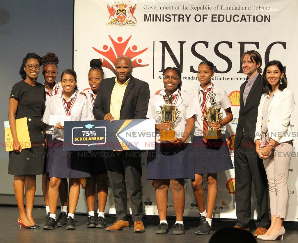 Bishop Anstey's Shanaryah Saunders, Imani Griffith, Jennika Lynch, Moesha Lynch, Javanna Glasgow and teacher Danielle Holder celebrate their victory as orverall winners of the National Secondary School Entrepreneurship 2019 competition at NAPA, Port of Spain on November 20. 
 Marcus McLeod of Arthur Lok Jack GSB, Sophia Stone and Christian Stone directors of 3Stone Research and Consulting Ltd presented the team with prizes. PHOTO BY ROGER JACOB.
 - ROGER JACOB