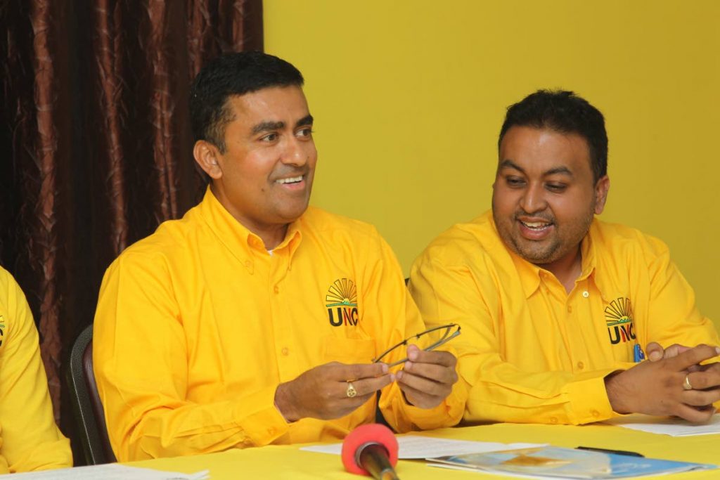 UNC general secretary Dave Tancoo and regional coordinator Brian Baig during a press conference at the party's headquarters in Couva on Friday. PHOTO BY LINCOLN HOLDER - 
