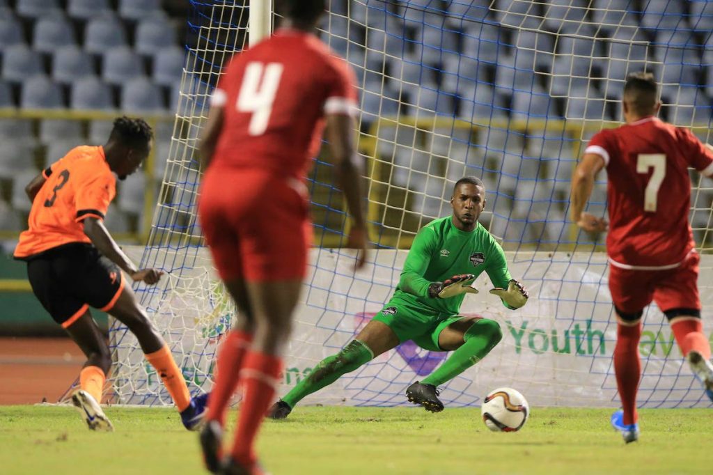 Club Sando’s hat-trick hero Shaqkeem Joseph (L) shoots and scores past Cunupia’s goalkeeper Keston 
Malchan, during match day 5 of the TT Pro Legue First Citizens Cup 2019 between Tiger Tanks Club Sando and Cunupia FC at the Hasely Crawford Stadium, Mucurapo.  -  Allan V. Crane/CA-images